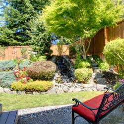 Beautiful landscape design for backyard garden with small bench